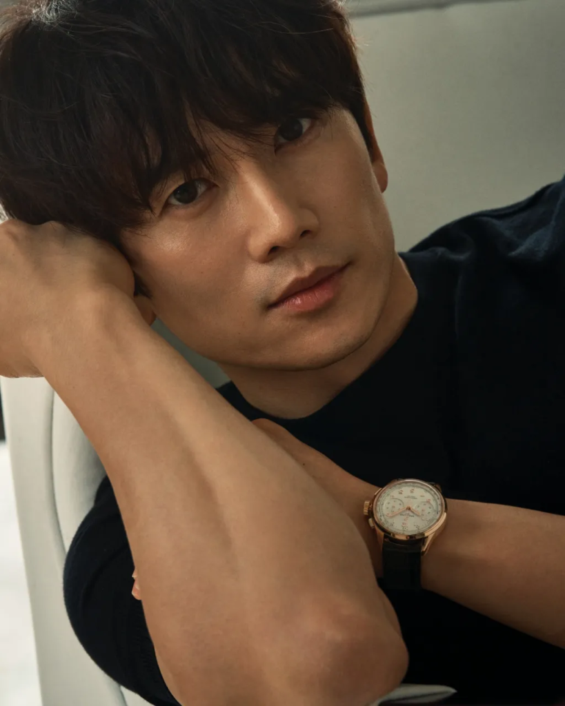 A professional profile picture of Korean actor Ji Sung, gazing forward with intense, deep eyes and a serious expression, optimized for the K-drama The Apartment Job review